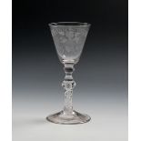 A Dutch-engraved 'Friendship' airtwist baluster glass, c.1740, engraved with a bunch of grapes and a