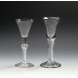 Two wine glasses, c.1760-70, one with a thick bell bowl rising from an airtwist stem, the other with