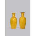 A PAIR OF CHINESE YELLOW-GROUND VASES 19TH CENTURY Each with a tall ovoid body, waisted neck and a