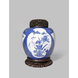 A CHINESE BLUE AND WHITE JAR 19TH CENTURY Painted with shaped panels of birds and blossoms against a