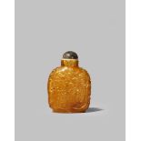 A CHINESE YELLOW AMBER SNUFF BOTTLE 19TH CENTURY With a flattened ovoid body carved in a honey