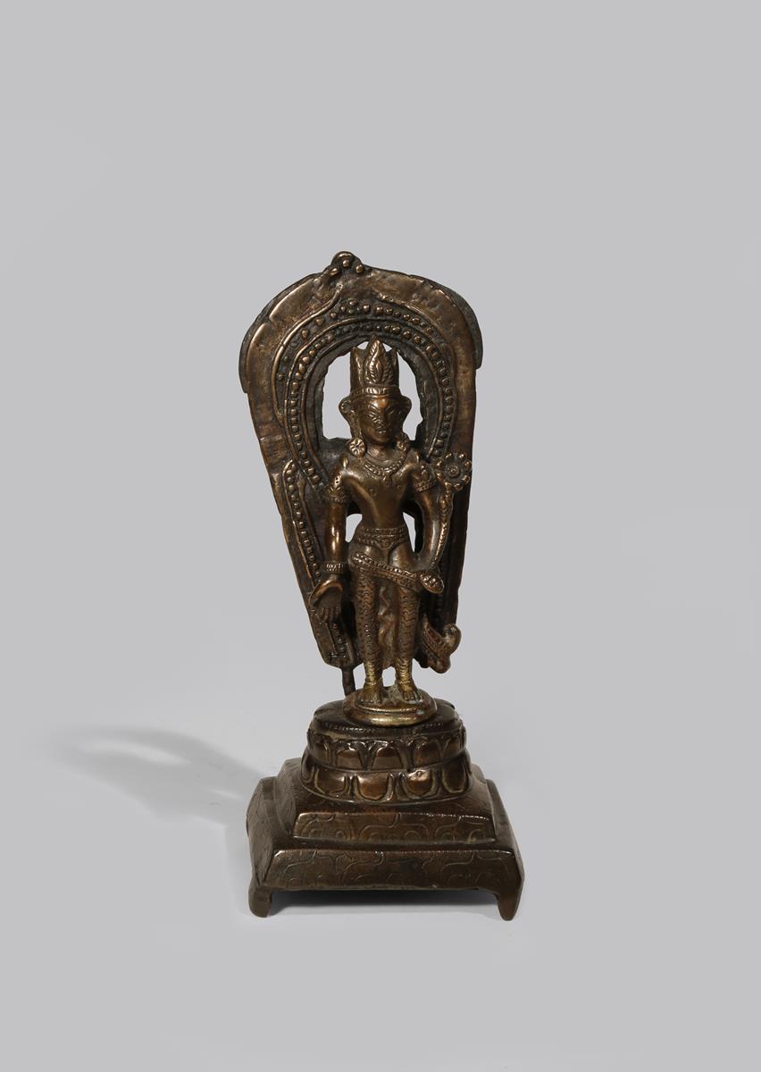 A WESTERN HIMALAYAN BRONZE FIGURE OF PADMAPANI 11TH/12TH CENTURY Standing, wearing a dhoti, a tall