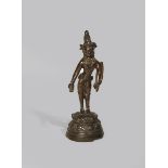 A TIBETAN BRONZE FIGURE OF PADMAPANI 12TH CENTURY Standing on a double lotus throne, wearing a