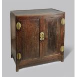 A CHINESE TIELIMU CABINET 19TH CENTURY With a rectangular top, above a pair of doors enclosing a