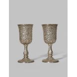 A PAIR OF INDIAN SILVER GOBLETS 19TH CENTURY Each with a chased and repoussé decoration of hunting