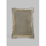 A LARGE CHINESE RECTANGULAR SILVER MIRROR 19TH CENTURY The frame with repoussé decoration of animals