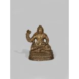 A TIBETAN GILT COPPER ALLOY FIGURE OF PADMASAMBHAVA AS PADMA GYALPO 15TH CENTURY Seated in with