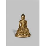 A TIBETAN GILT BRONZE FIGURE OF BUDDHA SAKYAMUNI 15TH CENTURY Seated in vajraparyankasana on a