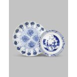 TWO CHINESE BLUE AND WHITE DISHES KANGXI 1662-1722 The larger painted with the aster pattern, the