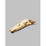 A JAPANESE IVORY MODEL OF A BANANA, OKIMONO MEIJI 1868-1912 Naturalistically carved, the skin peeled