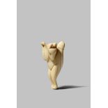 A JAPANESE IVORY NETSUKE EDO 1615-1868 Carved as a stylised dancing fox, kitsune, standing upright