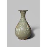 A KOREAN CELADON VASE KORYO DYNASTY The pear-shaped body decorated with four sprays of flowers,