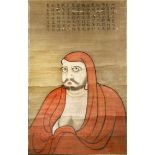 A LARGE JAPANESE SCROLL PAINTING EDO/MEIJI PERIOD Depicting Daruma wearing a red hooded robe and