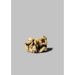 A JAPANESE IVORY NETSUKE EDO/MEIJI PERIOD Depicting a dog, a monkey and a rabbit wrestling, the