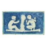 A Della Robbia Pottery plaque by Emily Margaret Wood, rectangular, cast in low relief with two naked