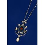 A silver and enamel pendant necklace and chain, the wirework frame cast with seven flower panels,