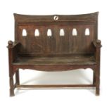 A Scottish pine bench in the manner of Wylie & Lochhead, the back with cut-out Art Nouveau tulip