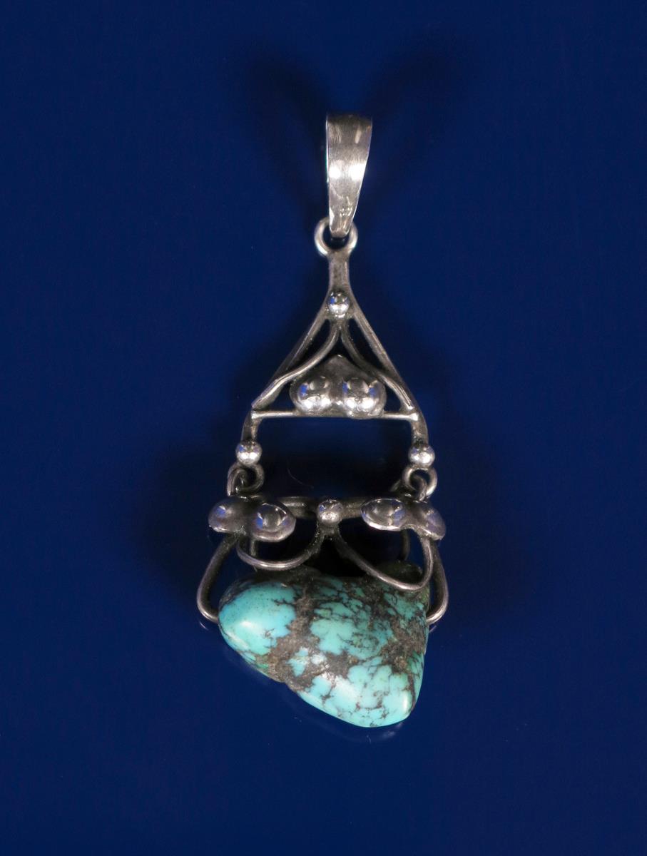 A silver and turquoise pendant possibly Liberty & Co, cast with berried foliage and set with a