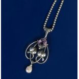 A silver and amethyst pendant necklace, the Art Nouveau wirework frame with heart shaped leaf panels