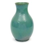 A Ruskin Pottery stoneware Souffle vase, dated 1913, pear shaped body covered in a streaked green