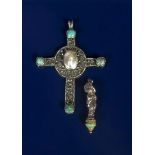 A silver and turquoise Celtic cross pendant, cast in low relief with wirework borders and