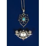 A silver pendant necklace, the heart-shaped wirework body with scrolls and set with a central