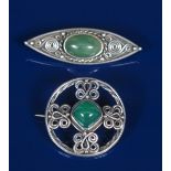 A Celtic Revival silver brooch, circular, with wirework knots, set with central chrysoprase, and