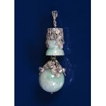 A large silver and jadeite pendant the design attributed to Amy Sandheim, cast sprays of foliage set