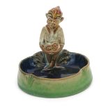 A Doulton Lambeth stoneware Pixie bibelot designed by Harry Simeon, model no.8781, the pixie