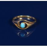 An Art Nouveau gold ring by E.F. Braham, simple scrolling design set with a small turquoise stone,