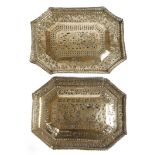 A pair of Indian brass trays, of canted rectangular shape with pierced and engraved decoration of