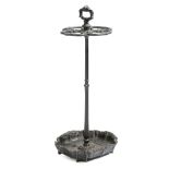 A Victorian cast iron umbrella stand by Kenrick & Sons, with a handle above four divisions, the base