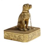 An early 19th century gilt brass model of a seated dog in the manner of the Weeks Museum, chained to