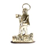 A Victorian brass figural doorstop, in the form of an old man walking holding a pint of beer, on a