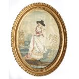 A George III silkwork picture, depicting a lady in a landscape, picking flowers, with painted