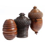 Three 19th century treen coquilla nut nutmeg graters, one in the form of an acorn, one barrel shaped