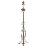 An Art Nouveau brass and copper standard lamp, with two lights, with open scroll decoration, 176.5cm