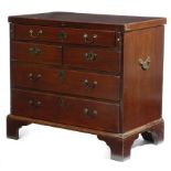 A mahogany bachelor's chest, with a later hinged fold-over top, above an arrangement of five