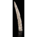 λ A 19th century African Loango tribal ivory tusk, carved with a procession of semi-naked figures