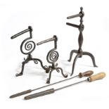 Two similar 18th century wrought iron and bronze tally or goffering irons, each with a scroll stem