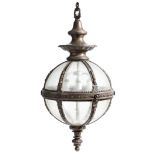 A bronze and white metal globe hall lantern, with twelve glass panels divided by bands of leaves,