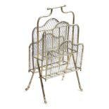 A late Victorian brass and wirework magazine rack, with four divisions, stamped 'S. H. & S.', with