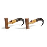 A pair of treen and horn boot-pulls, the carved handles in the form of riding boots, late 19th /