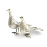 Two metalware birds, marked to the underside of the tail, modelled as standing doves, textured