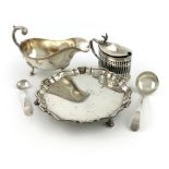 A mixed lot of silver items, comprising: an Edwardian waiter, London 1903, moulded border, the
