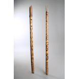 Two Papua New Guinea flutes Melanesia bamboo with incised and stained geometric decoration, each