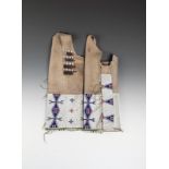 A pair of Sioux woman's leggings buckskin, coloured glass beads and tin cones, part beaded in lazy