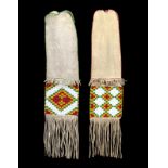 Two similar Sarcee pipe bags buckskin and coloured glass beads, with differing geometric designs