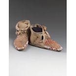 A pair of Sioux child's moccasins buckskin, quill and coloured glass beads, with ten rows of stained