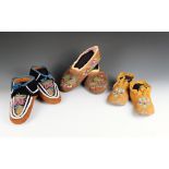 Three pairs of North American moccasins buckskin, velvet, glass beads and cotton, including an